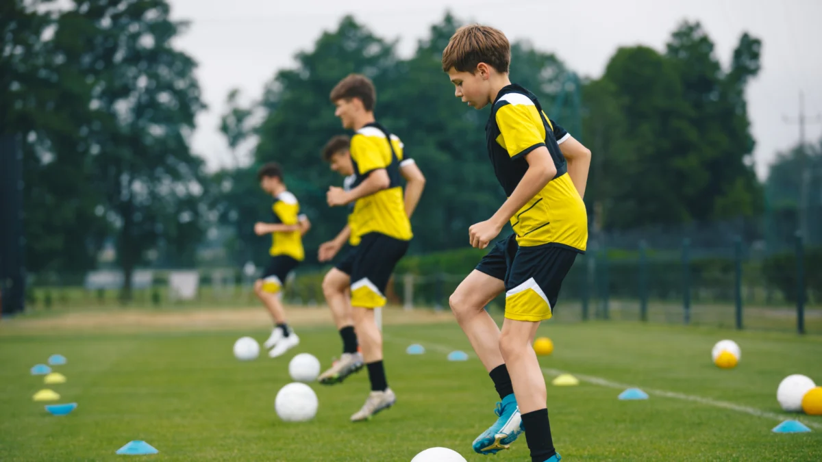 Young footballers in yellow kit training at their local club